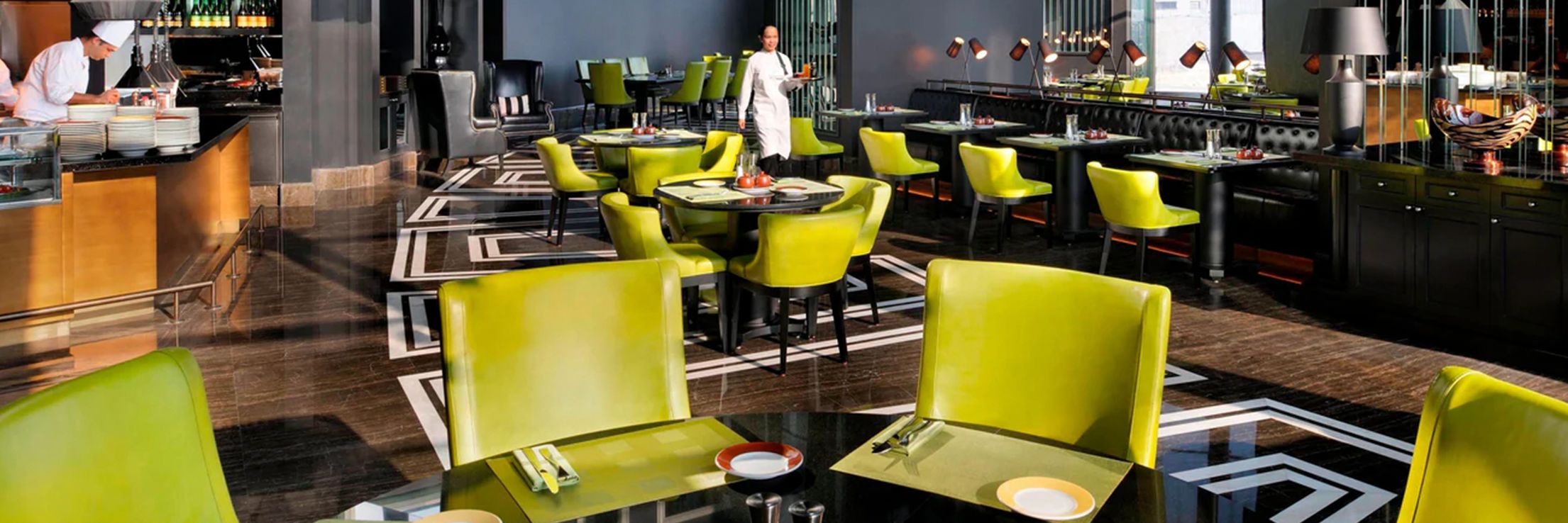 Modern style restaurant seating and uniformed staff